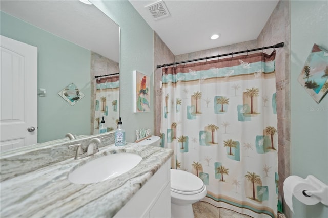 bathroom with toilet, a shower with shower curtain, and vanity