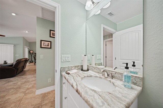 bathroom with tile patterned flooring and vanity