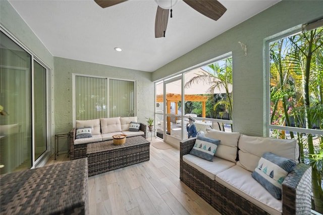 sunroom / solarium with ceiling fan