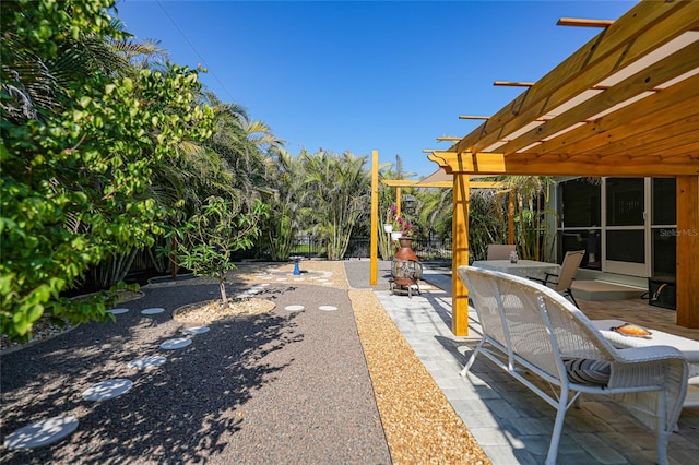 view of yard with a pergola and a patio