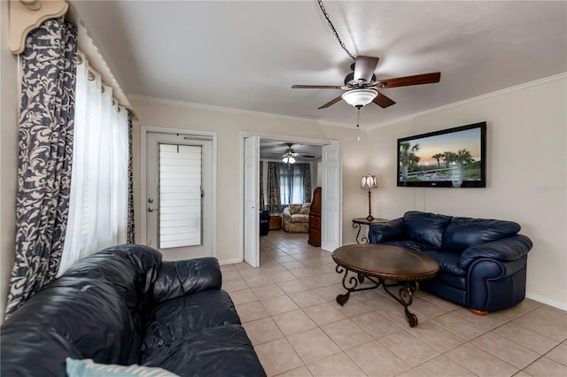 living room featuring plenty of natural light, light tile patterned flooring, and crown molding