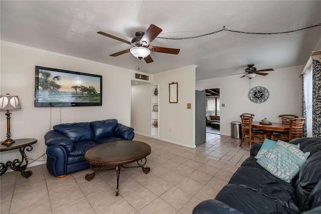 living room with ceiling fan, light tile patterned floors, and ornamental molding