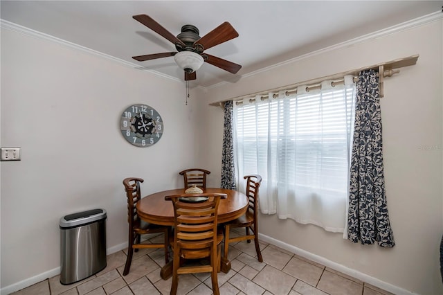 dining space with ceiling fan, light tile patterned flooring, and ornamental molding