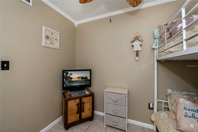 living area with light tile patterned floors and ornamental molding