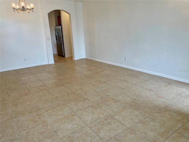 empty room featuring a chandelier