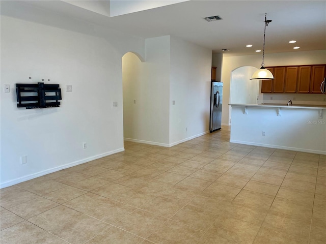 empty room with light tile patterned floors