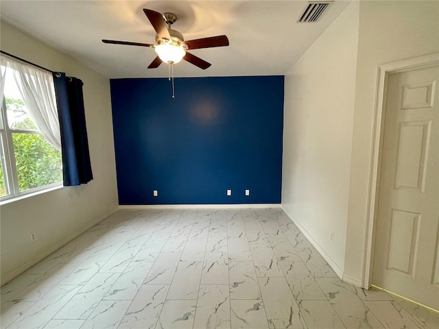 unfurnished room featuring ceiling fan