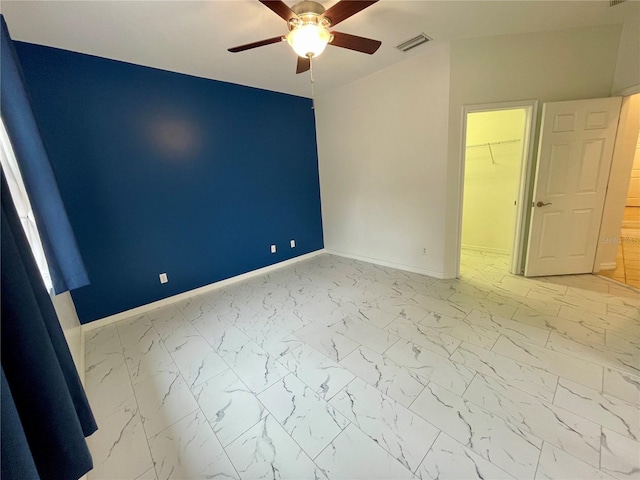 empty room featuring ceiling fan