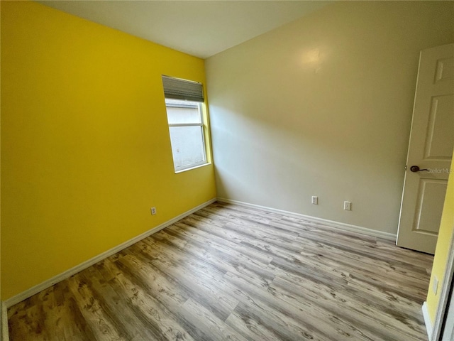 unfurnished room with light hardwood / wood-style flooring