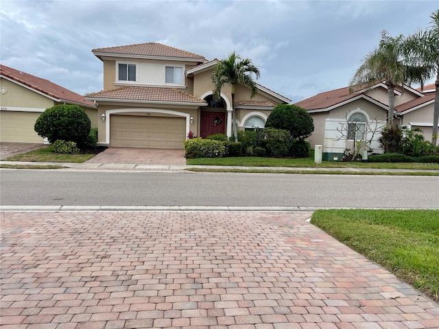 mediterranean / spanish-style home featuring a garage