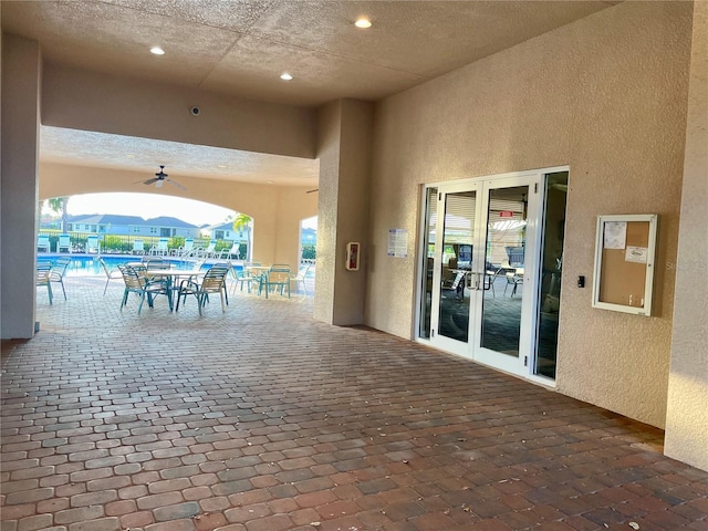 view of patio featuring ceiling fan