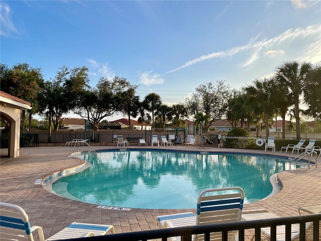 view of swimming pool with a patio