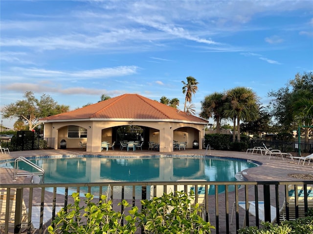 view of swimming pool with a patio