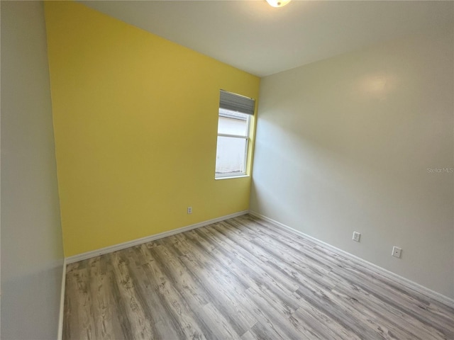 spare room featuring light hardwood / wood-style flooring