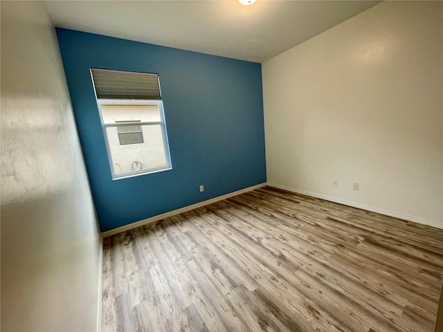 unfurnished room featuring light wood-type flooring