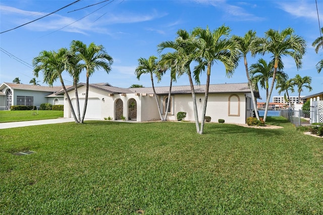 view of front facade with a front yard and a garage