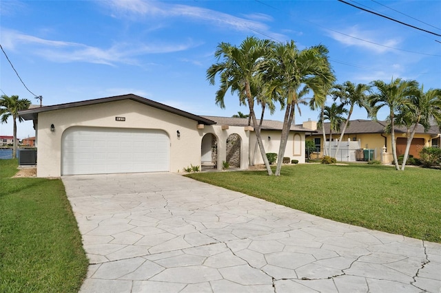 ranch-style house with a front lawn, central AC unit, and a garage