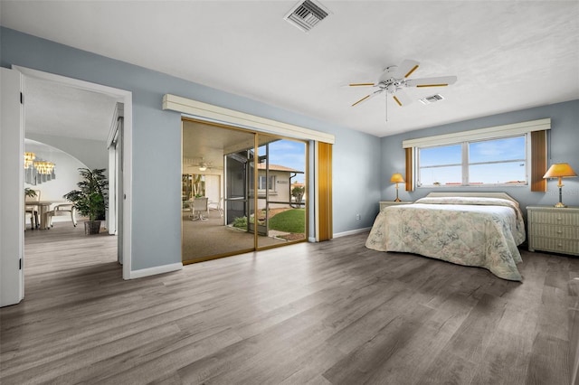 bedroom with access to exterior, ceiling fan, and hardwood / wood-style flooring