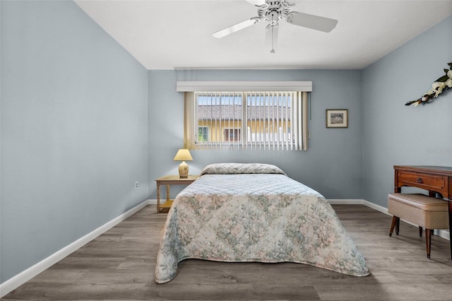 bedroom featuring hardwood / wood-style floors and ceiling fan