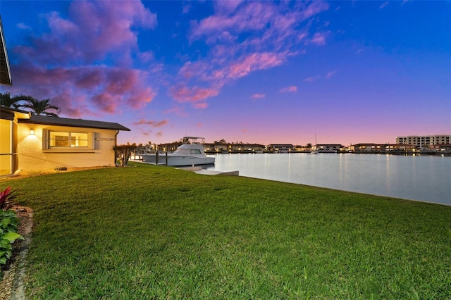 yard at dusk with a water view