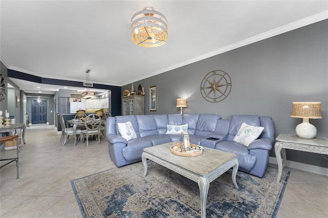 living area with crown molding, baseboards, and light tile patterned floors