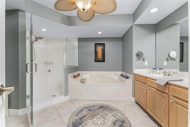 full bath with a stall shower, tile patterned floors, vanity, a bath, and recessed lighting