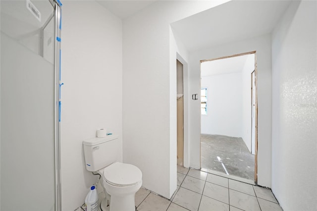 bathroom with tile patterned floors and toilet