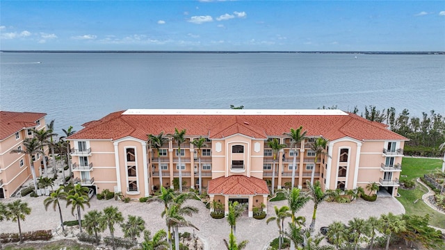 birds eye view of property with a water view