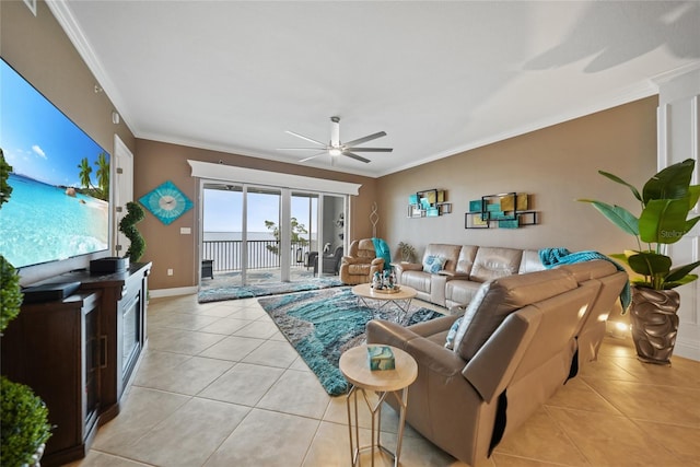 tiled living room with ceiling fan and ornamental molding