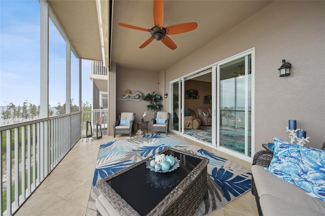 sunroom featuring ceiling fan