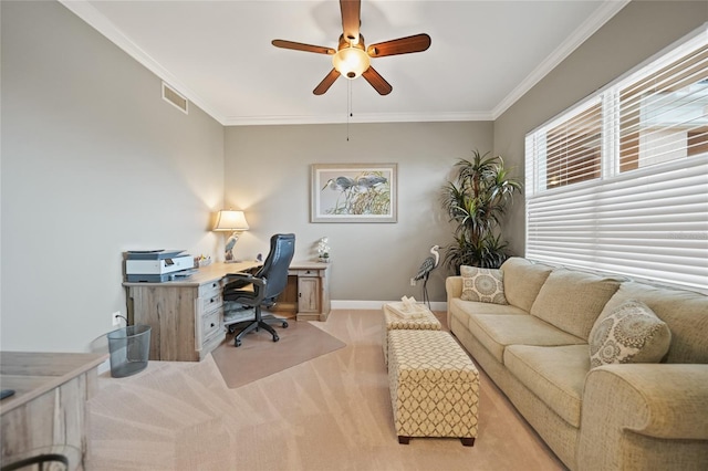 office space featuring ceiling fan, crown molding, and light carpet