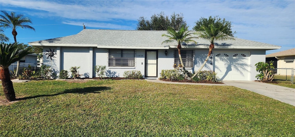 single story home with a front yard and a garage