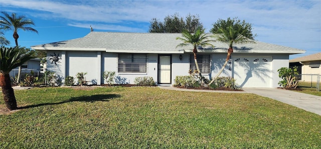 single story home with a front yard and a garage