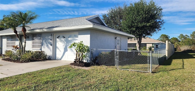 view of side of home featuring a yard and a garage