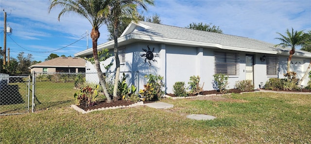 view of property exterior featuring a lawn