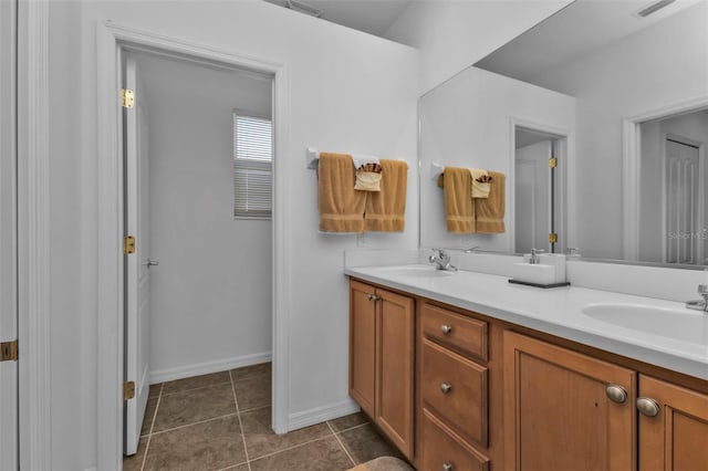 bathroom featuring tile patterned floors and vanity