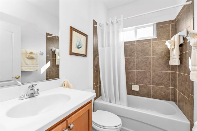 full bathroom featuring toilet, vanity, and shower / tub combo with curtain