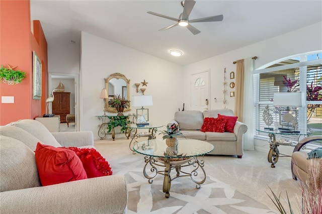 carpeted living room featuring ceiling fan and lofted ceiling