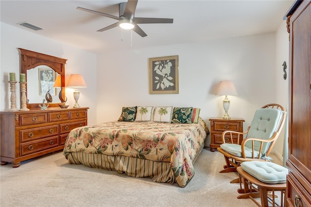 bedroom with light carpet and ceiling fan