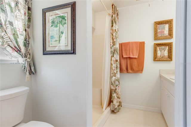 bathroom with vanity, tile patterned flooring, a shower with shower curtain, and toilet