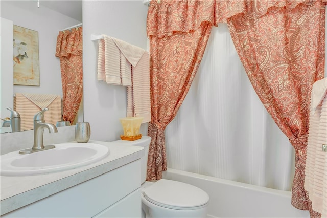 full bathroom featuring shower / bath combination with curtain, vanity, and toilet