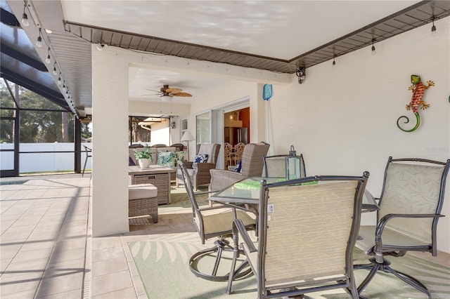 view of patio / terrace with glass enclosure and ceiling fan