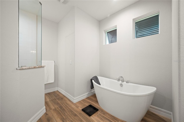 bathroom featuring a bathing tub and hardwood / wood-style floors