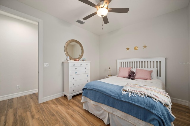 bedroom featuring hardwood / wood-style floors and ceiling fan