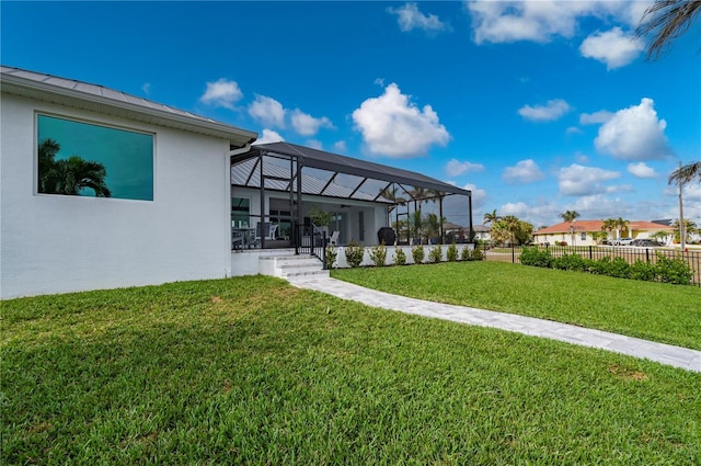 view of yard featuring glass enclosure