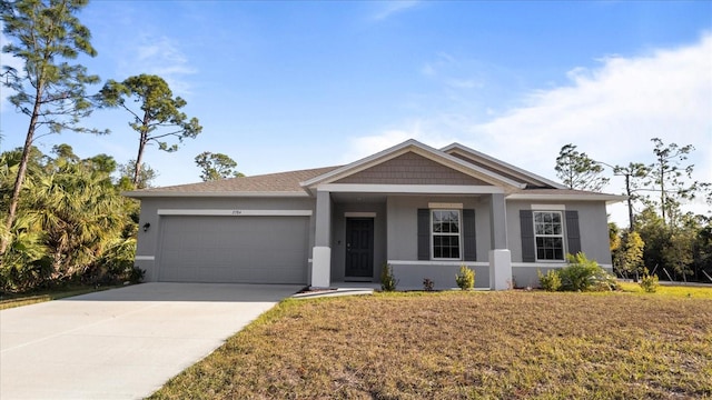 view of front facade with a front yard and a garage