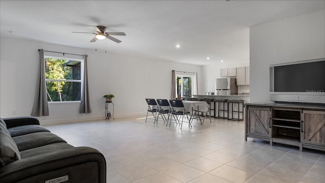 2784 Dode Ave, North Port, FL 34288 - living room featuring plenty of natural light, a ceiling fan, light tile patterned flooring, and recessed lighting