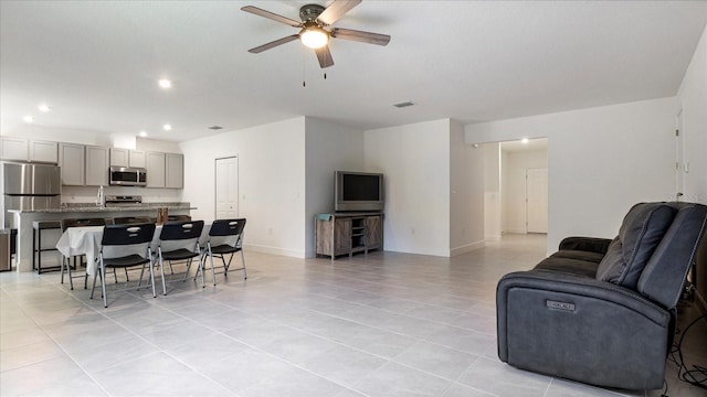 2784 Dode Ave, North Port, FL 34288 - living room featuring a ceiling fan, light tile patterned floors, and recessed lighting