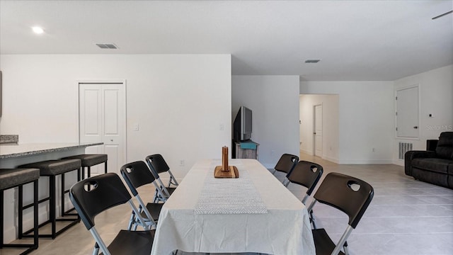 2784 Dode Ave, North Port, FL 34288 - dining room with light tile patterned flooring and baseboards
