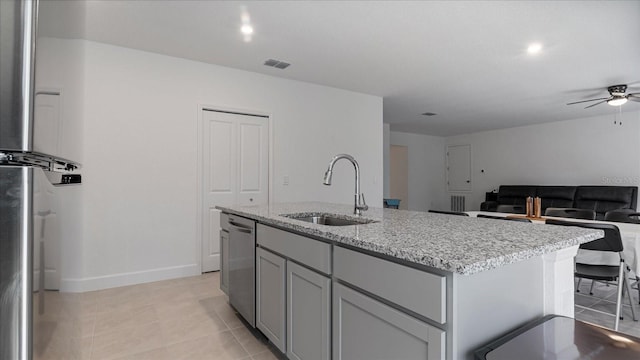 2784 Dode Ave, North Port, FL 34288 - kitchen with stainless steel dishwasher, a ceiling fan, light stone countertops, an island with sink, and open floor plan